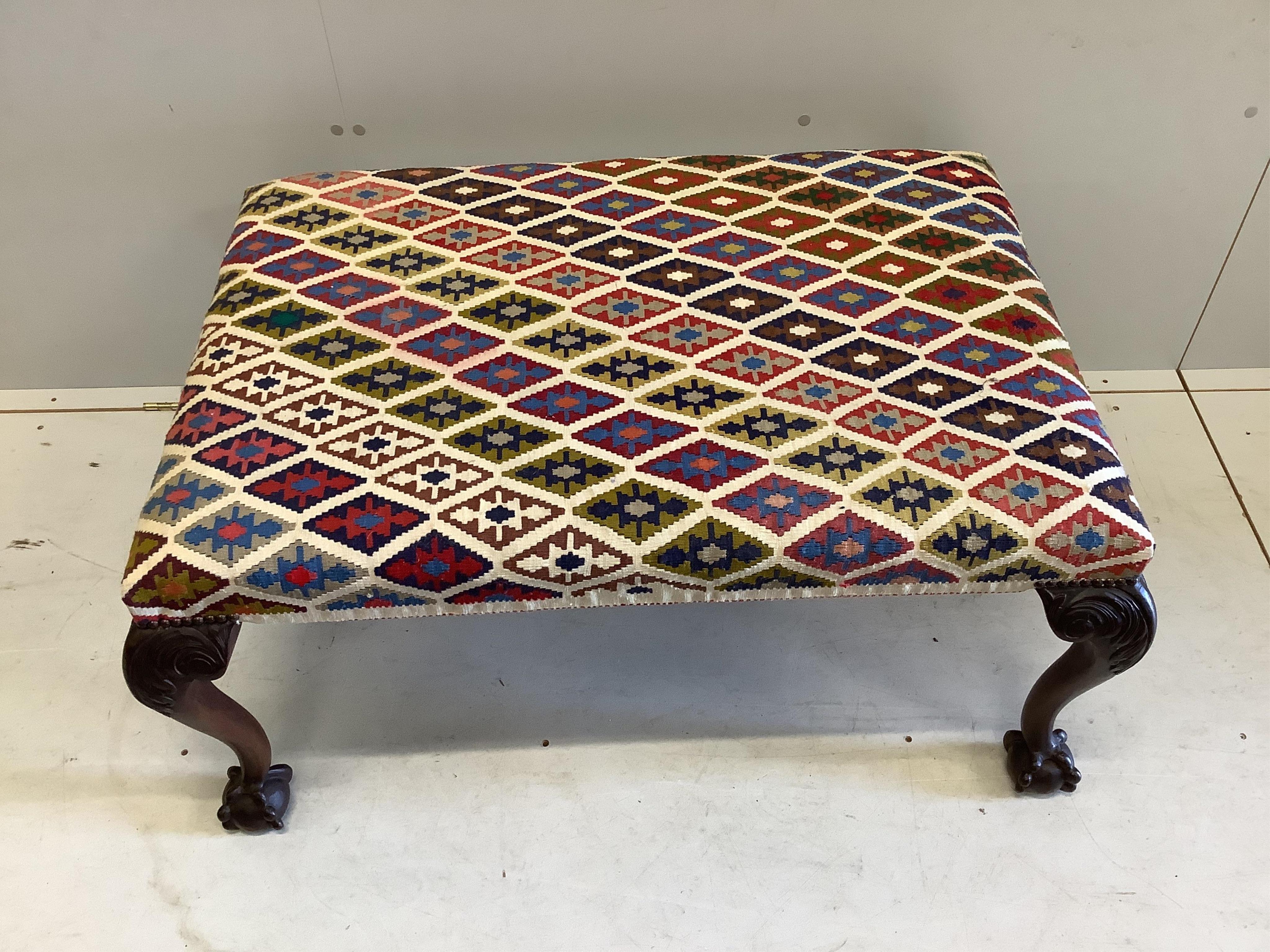 A Chippendale revival mahogany stool with Kelim upholstered seat, width 97cm, depth 67cm, height 47cm. Condition - good